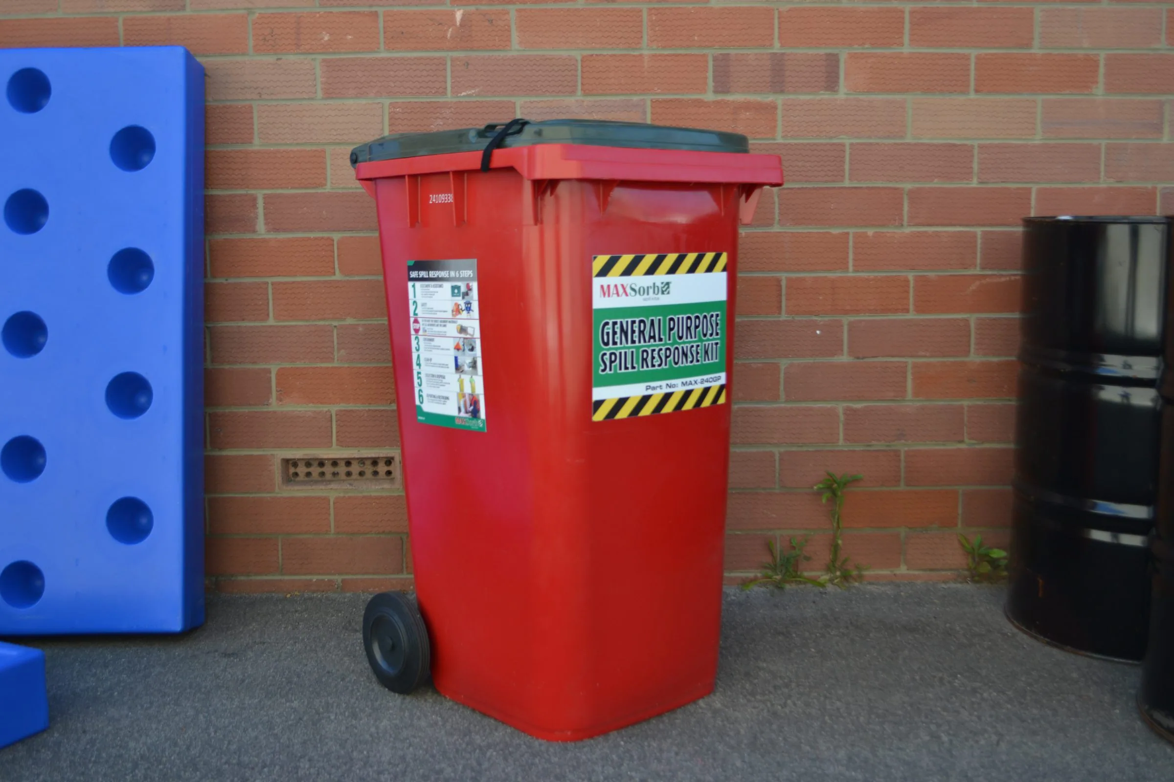 Red trash can with a sign, related to latest news on Spill Kits.